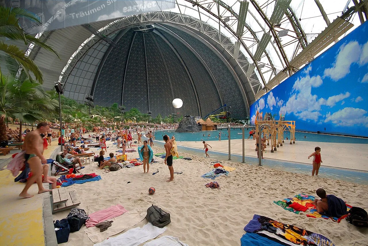 Indoor beach and lagoon under the giant hangar dome at Tropical Islands near Berlin