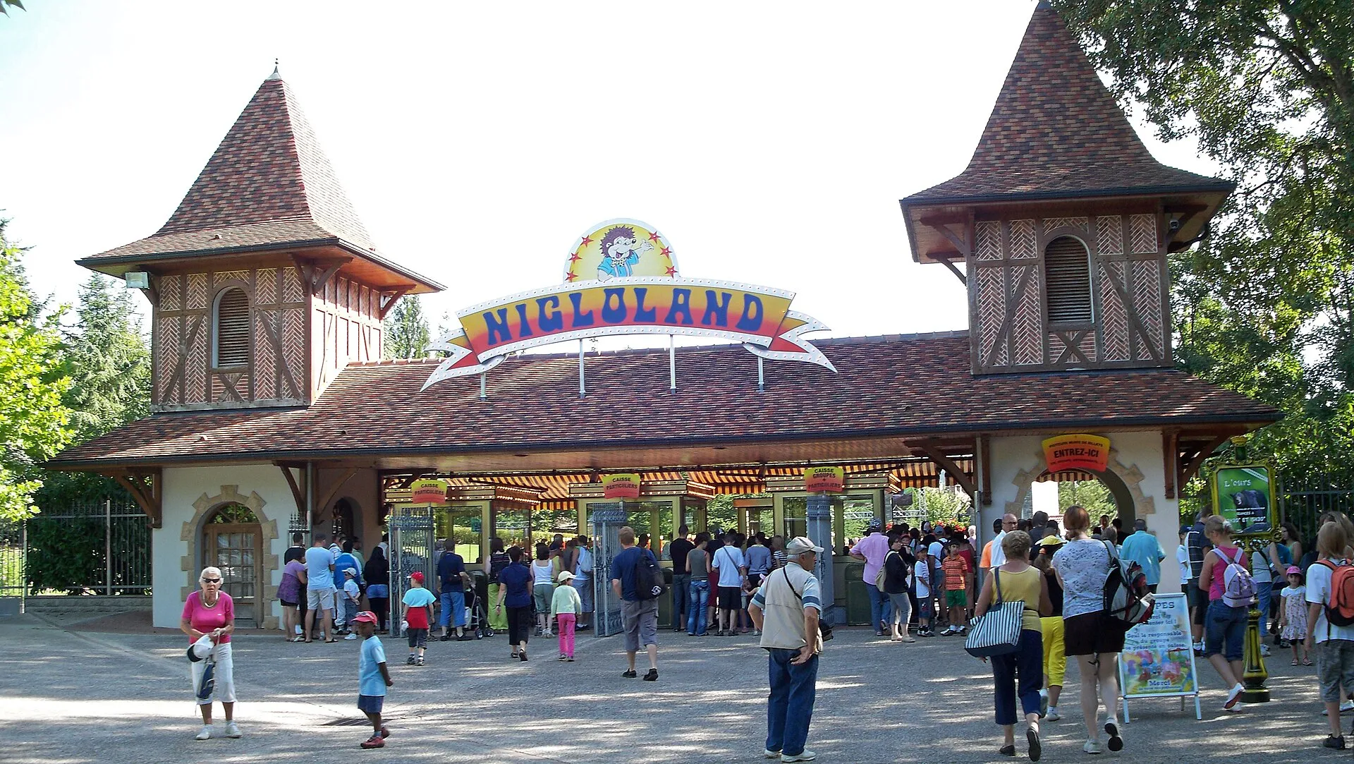 Timber-framed entrance gate of Nigloland theme park in Dolancourt with the Niglo hedgehog mascot sign