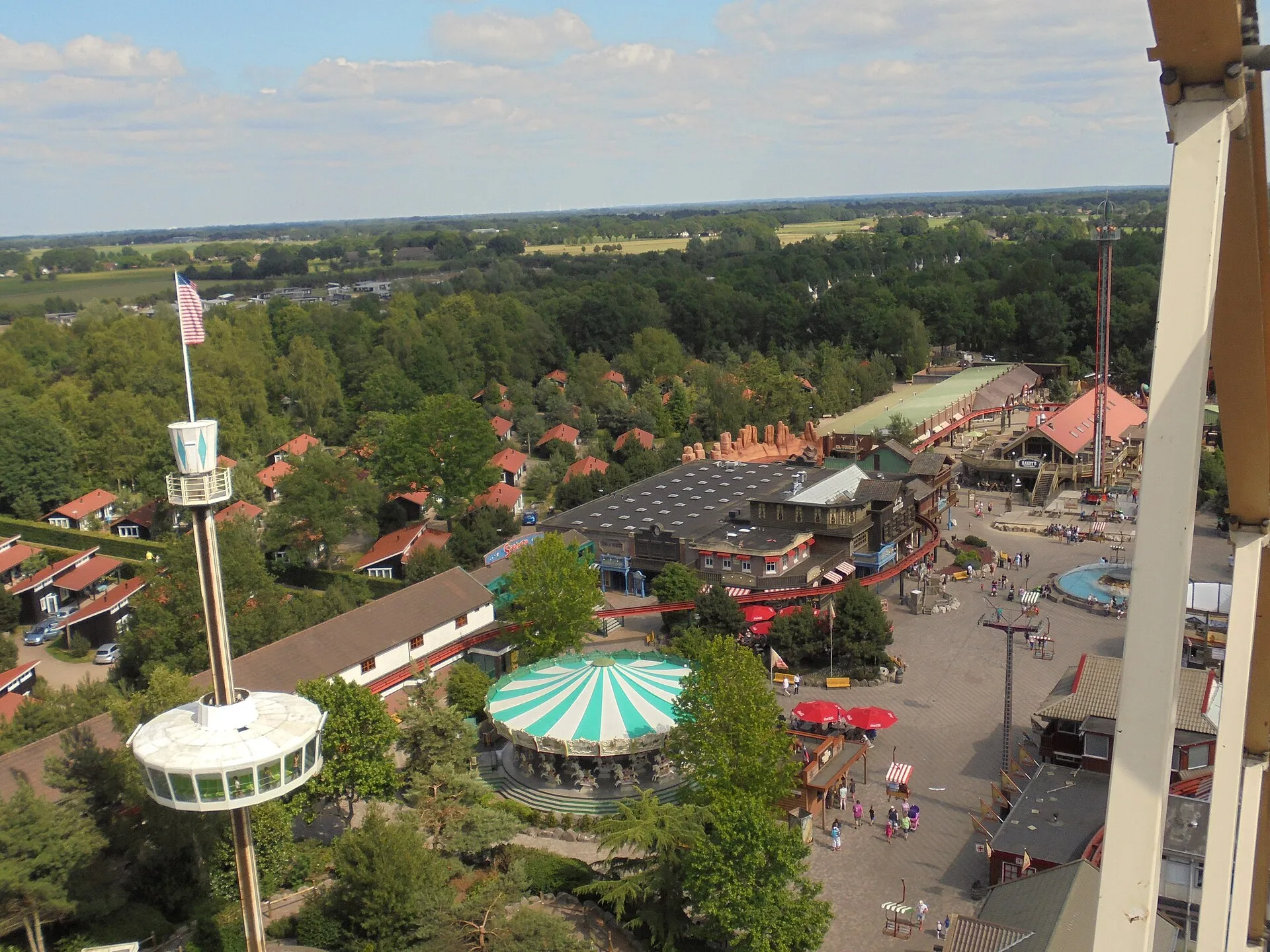 Aerial panorama of Attractiepark Slagharen with the carousel, Wild-West main street and observation tower