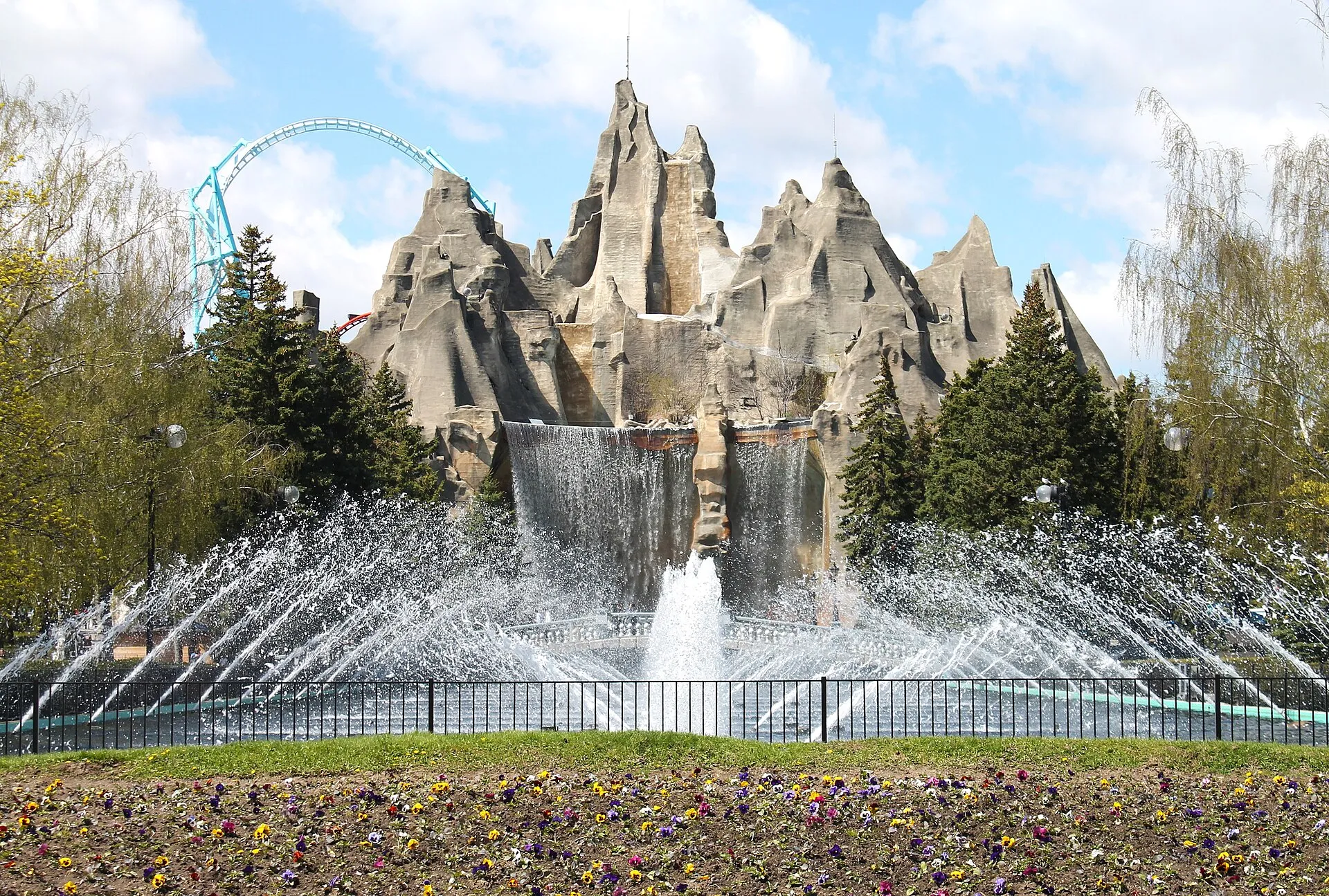 Wonder Mountain waterfall and fountains at the entrance of Canada's Wonderland with Leviathan's track behind