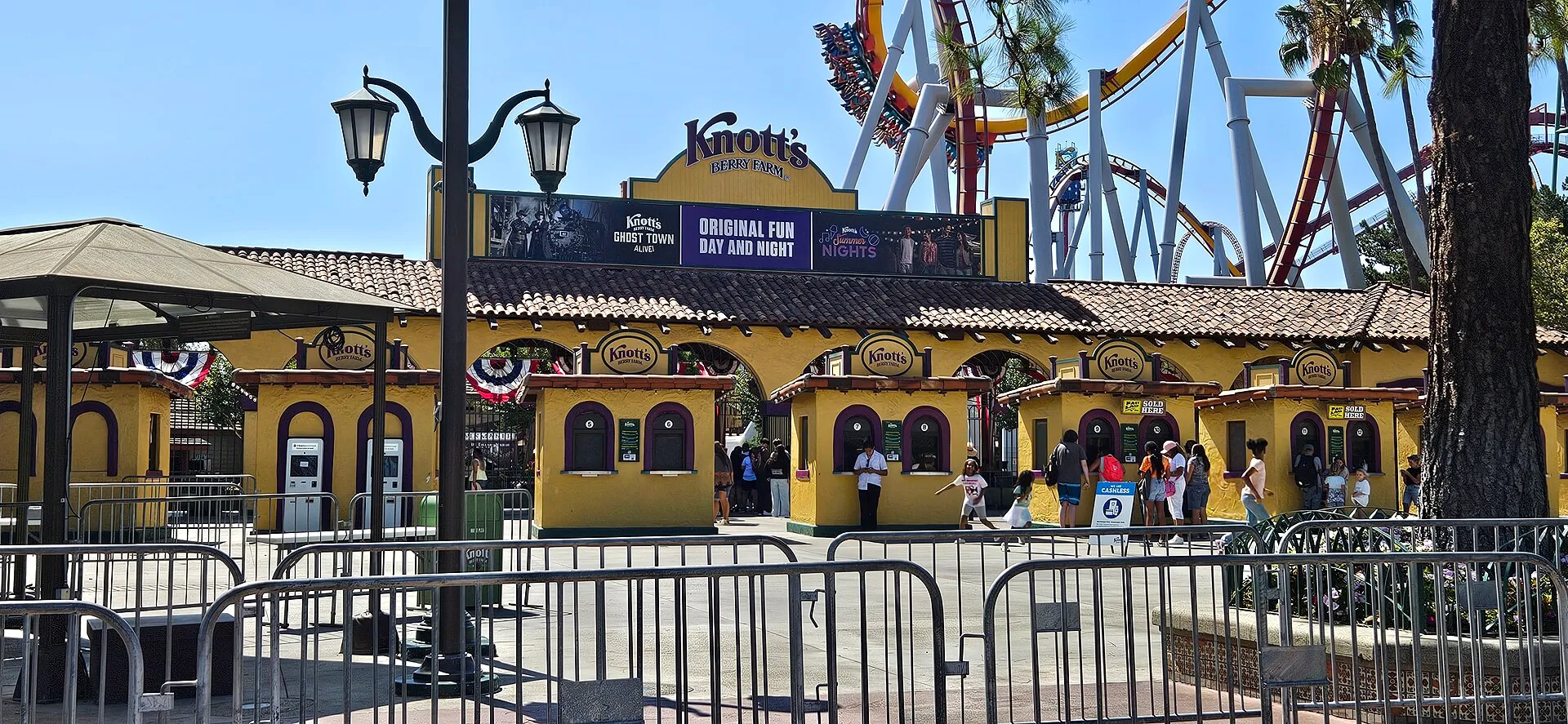 Ticket booths and roller coasters at the Knott's Berry Farm entrance in Buena Park, California