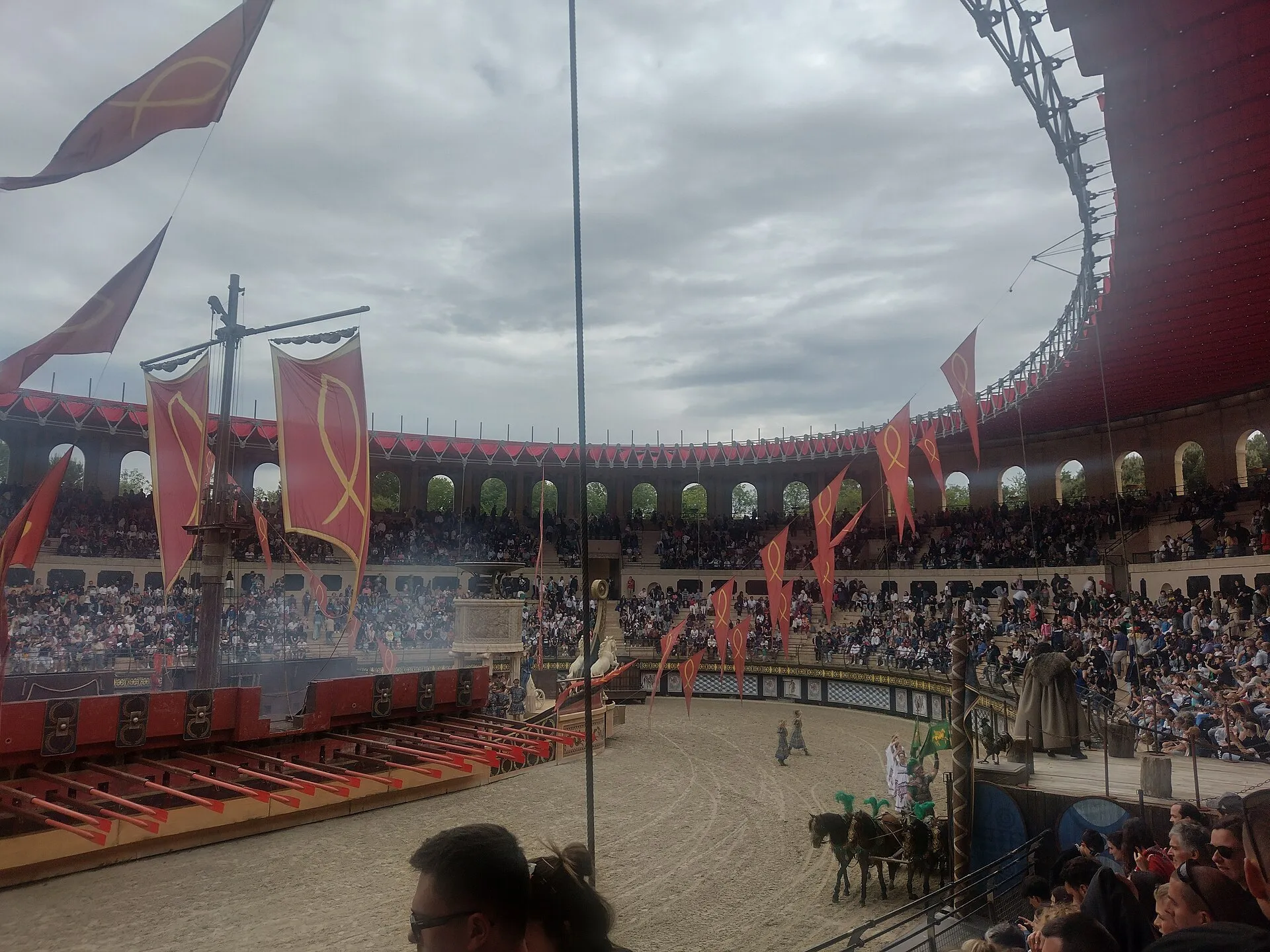 Roman arena show Le Signe du Triomphe with chariot and full stands at Puy du Fou