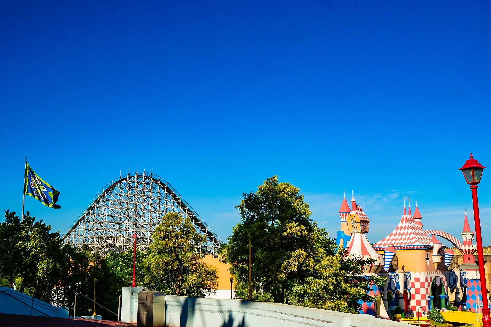 Montezum wooden roller coaster and the colorful castle towers of Infantasia at Hopi Hari theme park, Vinhedo, Brazil