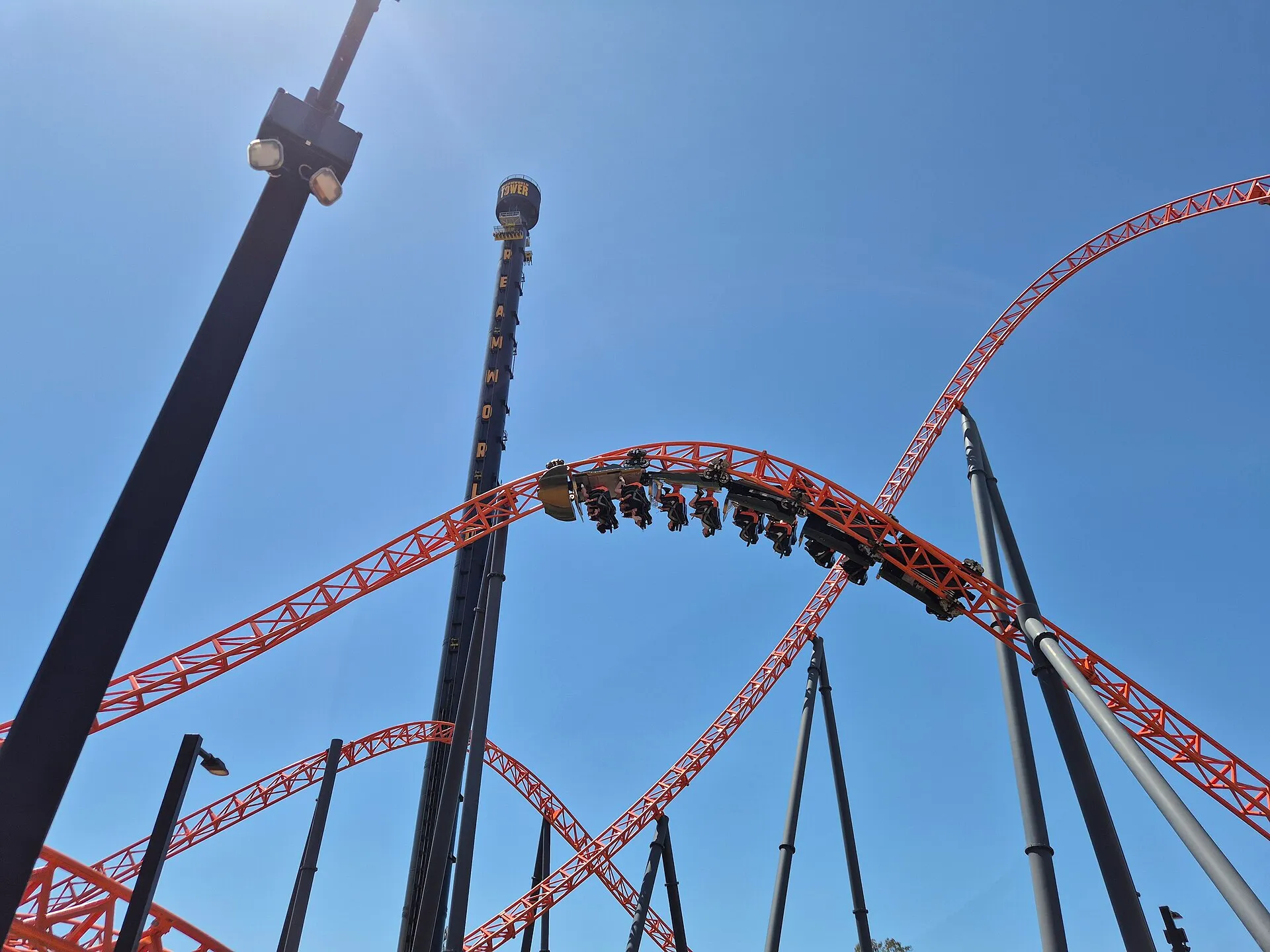 Steel Taipan roller coaster train mid-inversion at Dreamworld, Gold Coast