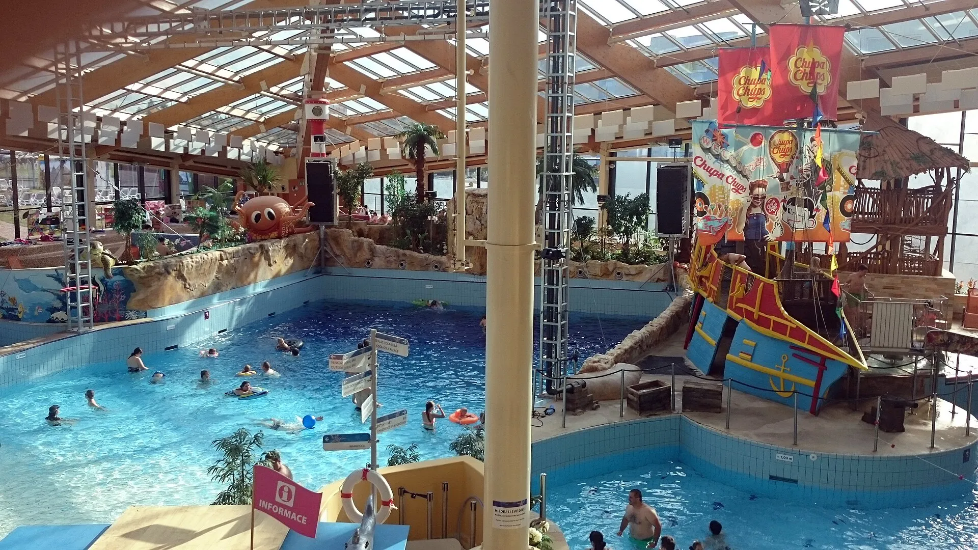 Wave pool and pirate ship under the glass roof of Aquapalace Praha indoor water park
